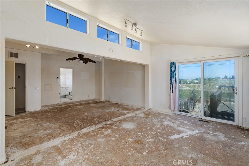 34881 Los Nogales Road Temecula, CA 92592 - Photo 32 of 50 Another view of the Primary Bedroom showing transom windows for extra lighting. Looking from the retreat and looking toward the primary bath.