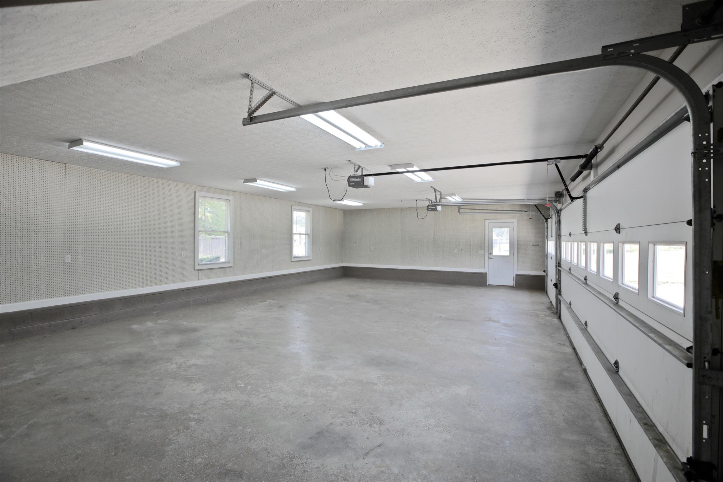 1734 Stop 30 Road Hendersonville, TN 37075 - Photo 28 of 30 Large 3 car garage. Walls lined with peg board to keep your garage organized.