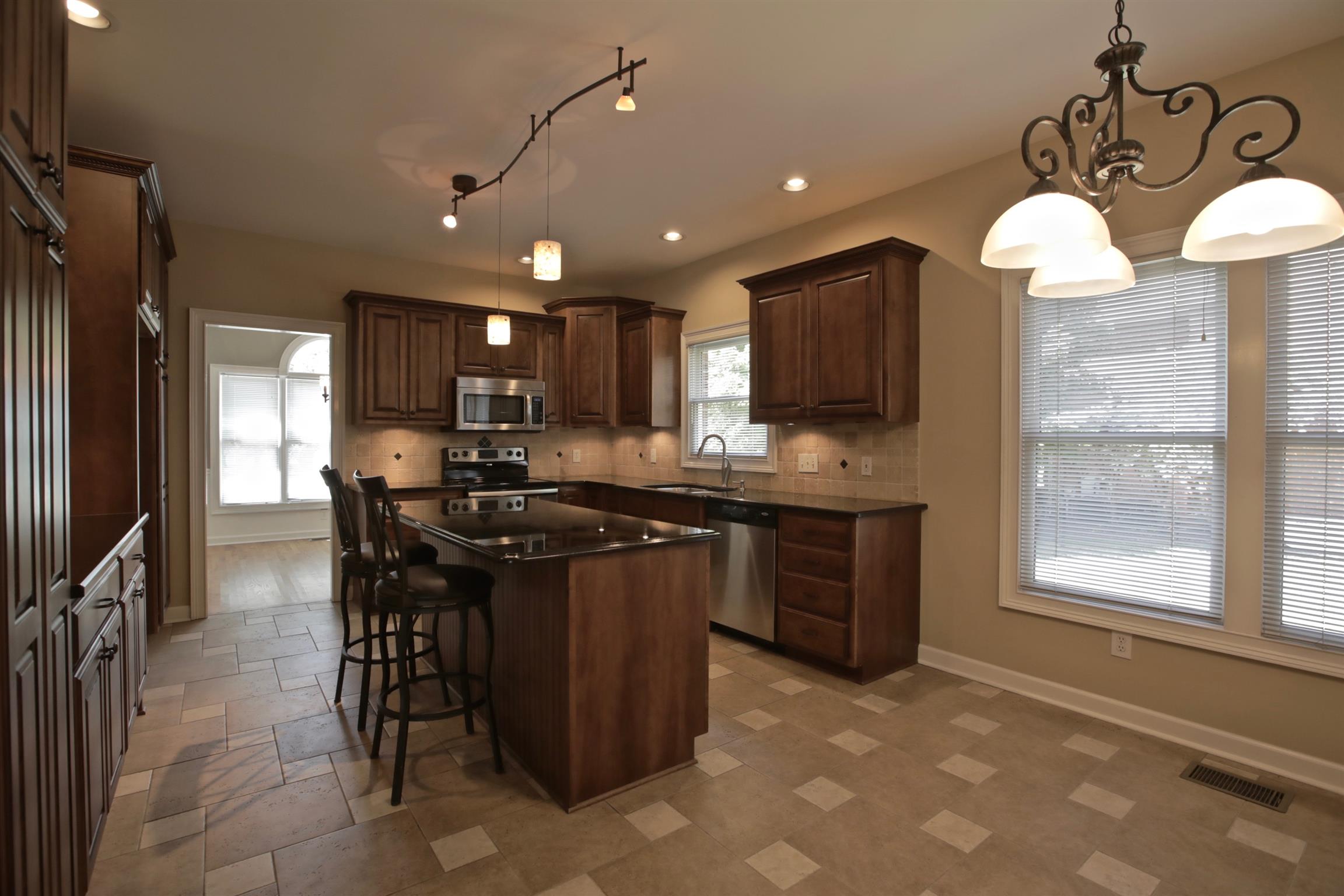 1734 Stop 30 Road Hendersonville, TN 37075 - Photo 10 of 30 Beautiful lighting and well designed tile. Stainless steel appliances