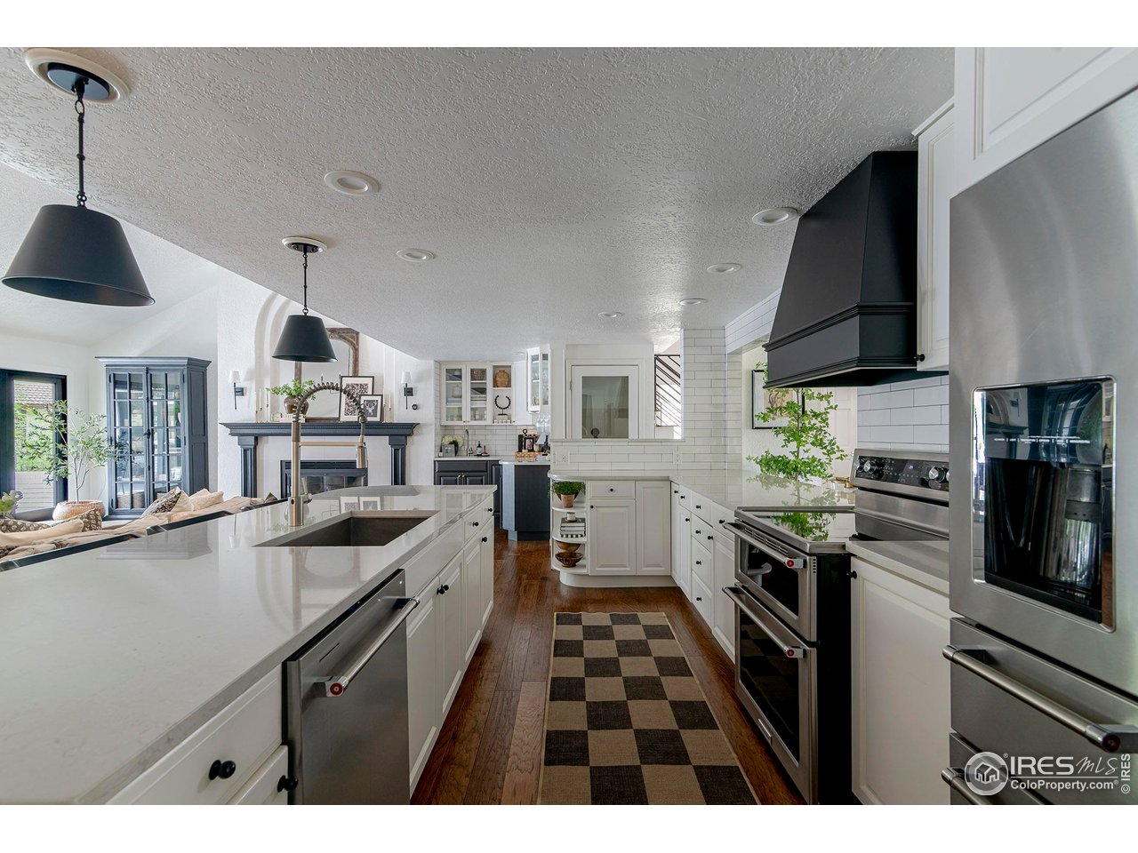 7204 Rustic Trail Boulder, CO 80301 - Photo 12 of 40 Large island, quartz countertops and stainless steel appliances.