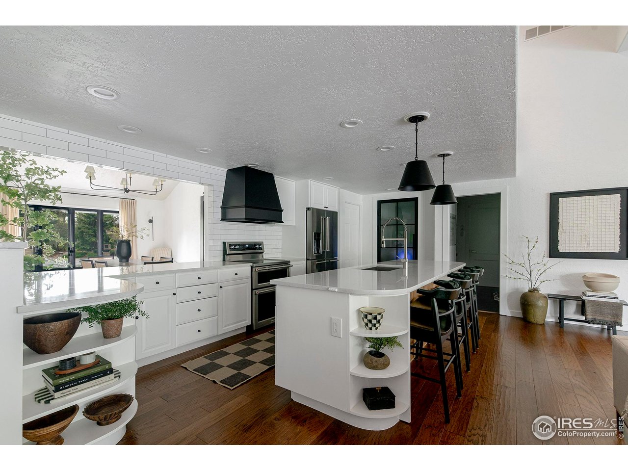 7204 Rustic Trail Boulder, CO 80301 - Photo 13 of 40 Large island, quartz countertops and stainless steel appliances.