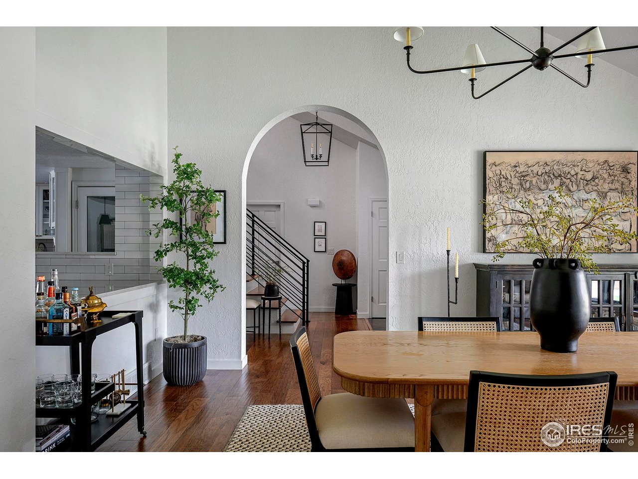 7204 Rustic Trail Boulder, CO 80301 - Photo 16 of 40 The large dining room has vaulted ceilings and arches that lead to the foyer and the office