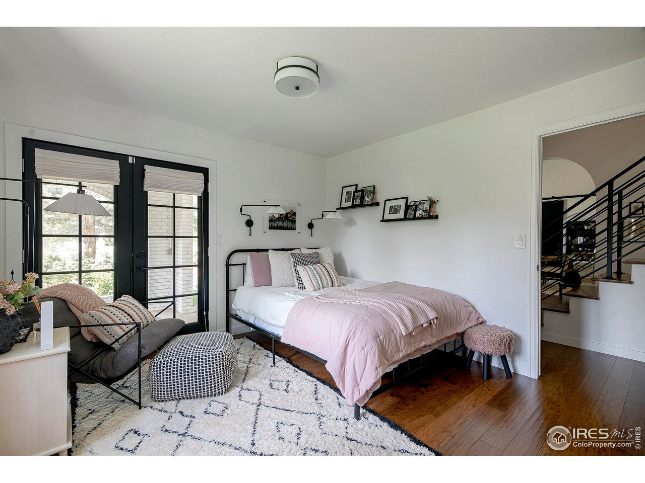 7204 Rustic Trail Boulder, CO 80301 - Photo 28 of 40 Secondary bedroom 2 on the main level has plenty of natural light and overlooks the front porch