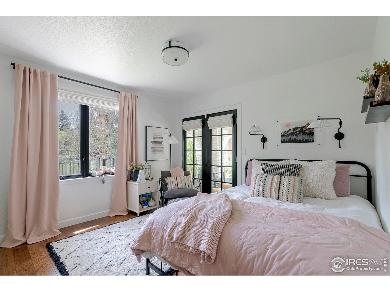 7204 Rustic Trail Boulder, CO 80301 - Photo 29 of 40 Secondary bedroom 2 on the main level has plenty of natural light and overlooks the front porch