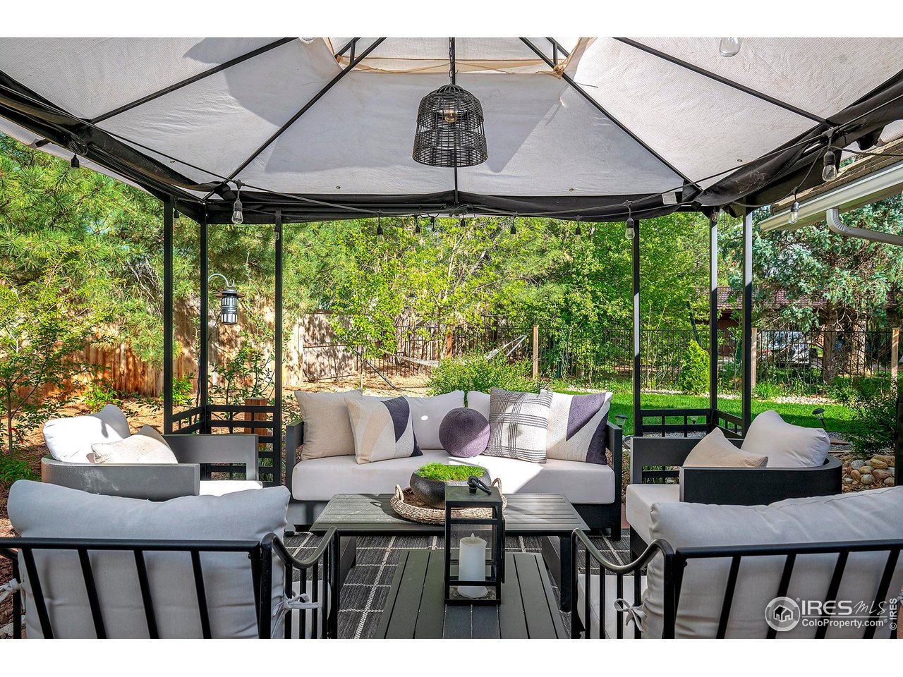 7204 Rustic Trail Boulder, CO 80301 - Photo 35 of 40 Outdoor seating area off of the family room. The large pergola is perfect for providing shade in the south facing yard