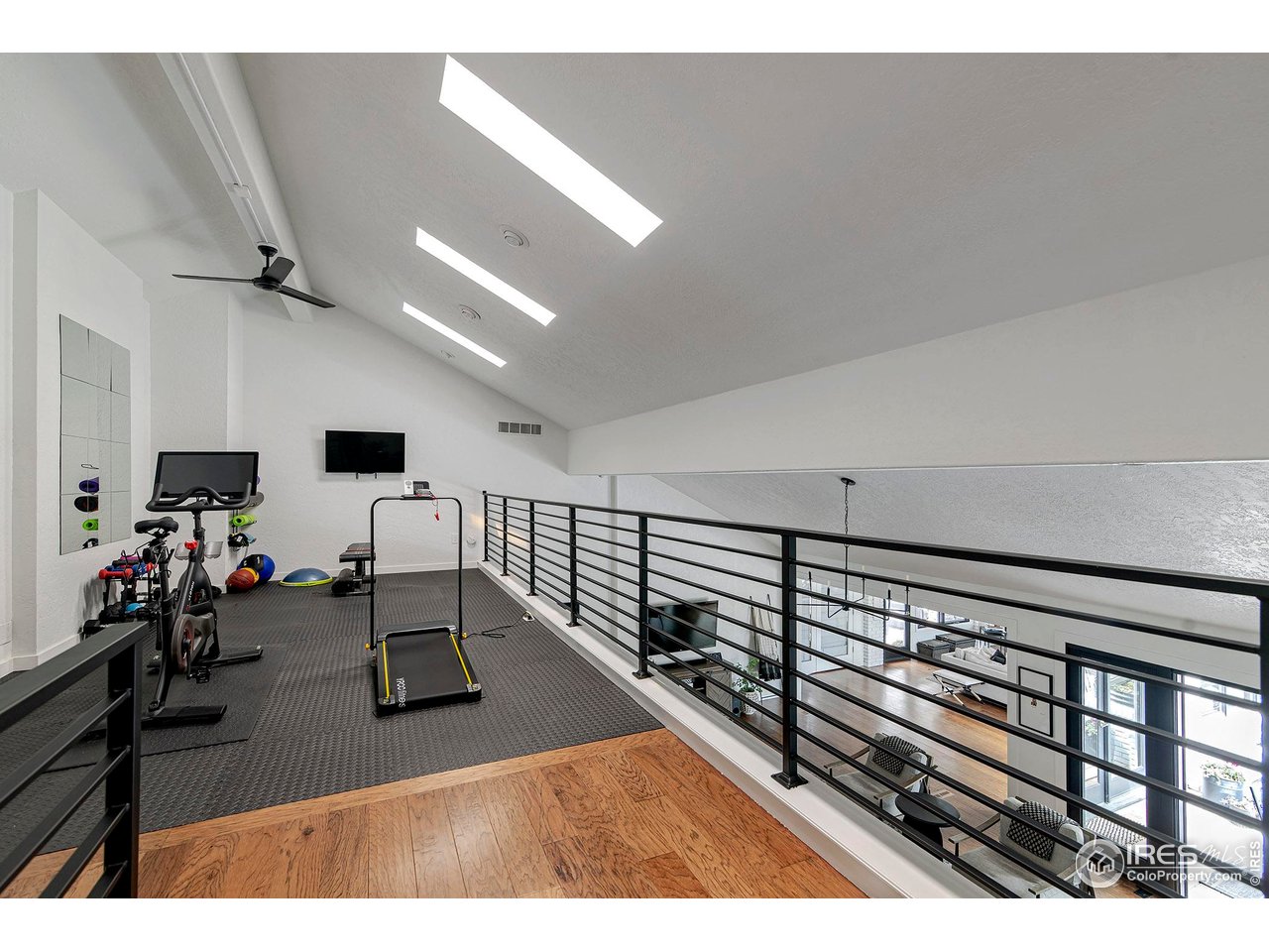7204 Rustic Trail Boulder, CO 80301 - Photo 37 of 40 Loft - currently used as gym - flex space for your needs. Black metal railing. Overlooks living room