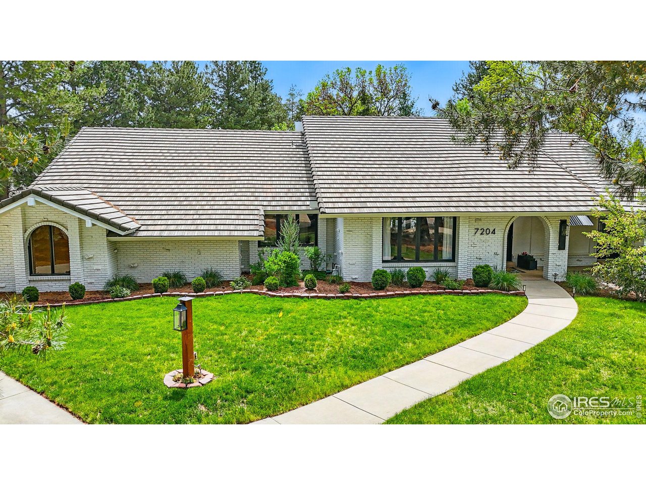 7204 Rustic Trail Boulder, CO 80301 - Photo 6 of 40 A classic Boulder Country Club architecture which has been updated while still maintaining its original architectural elegance