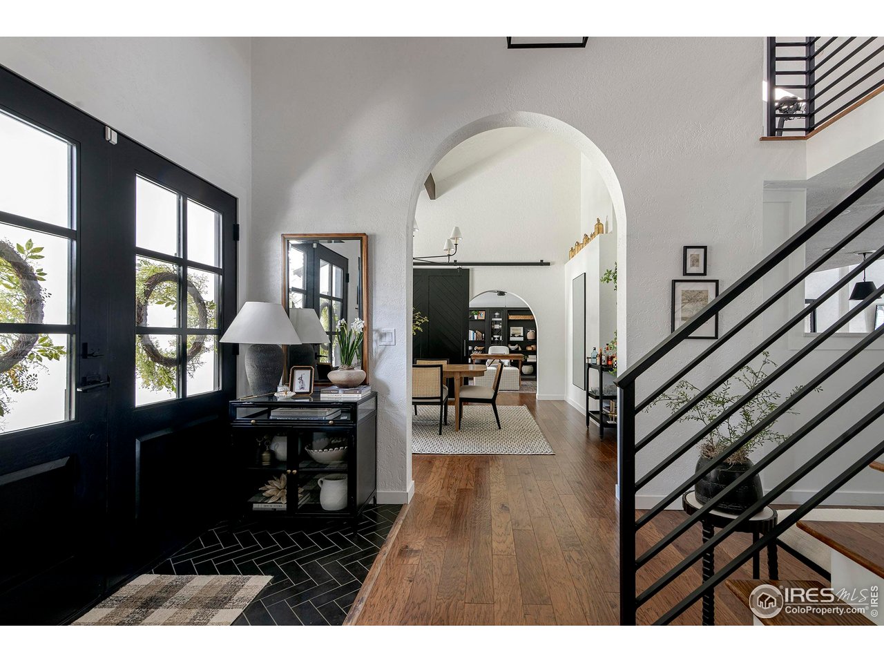 7204 Rustic Trail Boulder, CO 80301 - Photo 10 of 40 You are welcomed into the home via an arched entryway and double doors with sight lines from the front to the back of the home