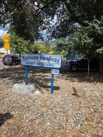a view of a street with benches