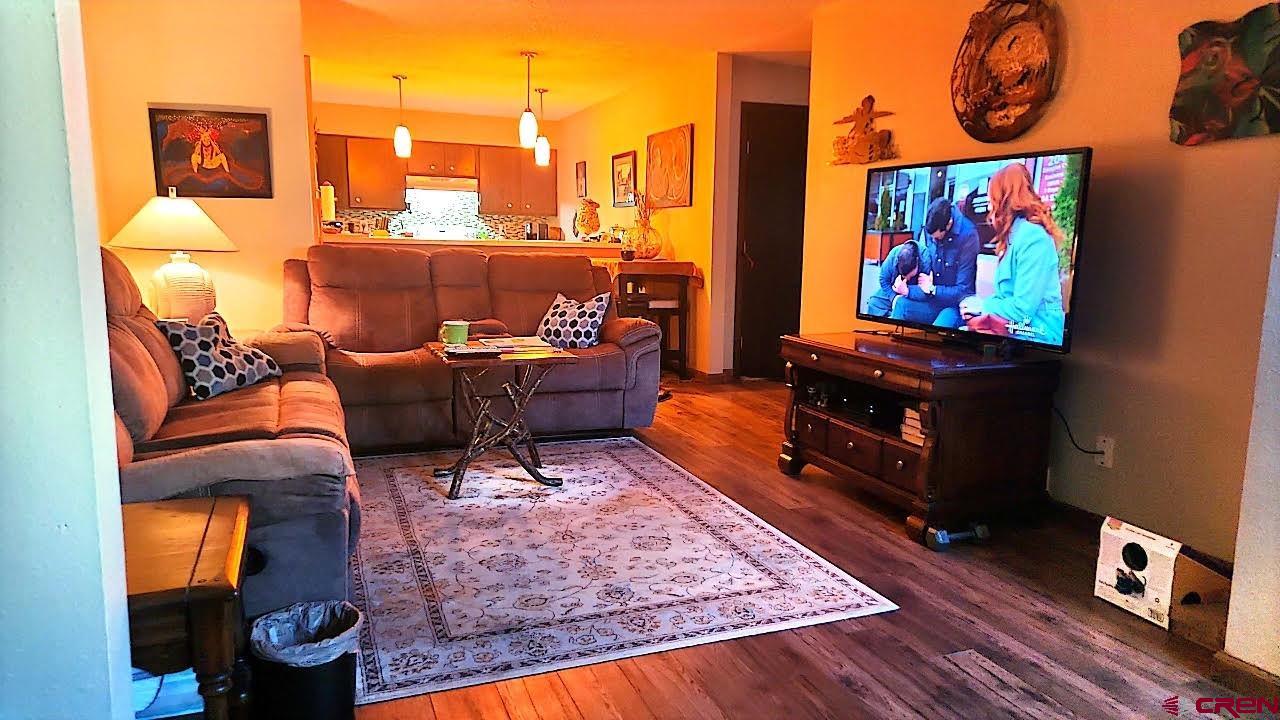 1135 Florida Road, Unit 4 Durango, CO 81301 - Photo 4 of 11 a living room with furniture and a flat screen tv