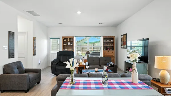 a living room with furniture rug and window