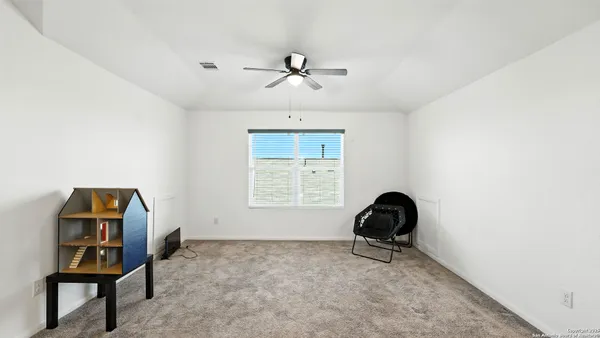 a workspace with furniture and a window