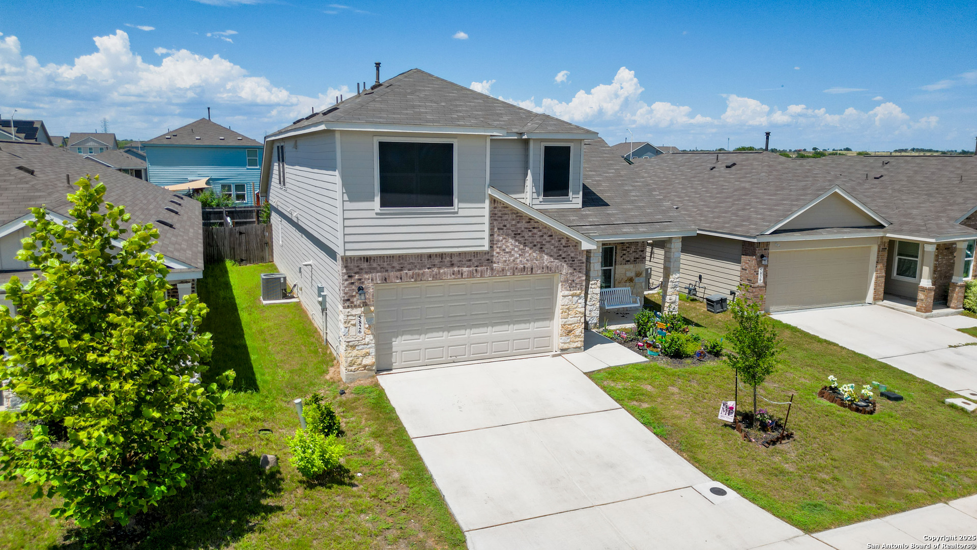 5826 Geronimo Way Seguin, TX 78155 - Photo 3 of 30 a front view of a house with garden