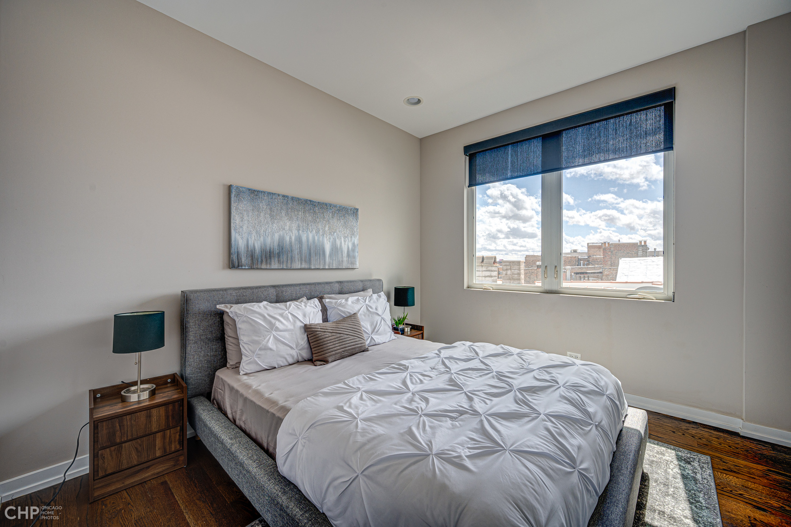 1033 South Racine Avenue, Unit 3SF Chicago, IL 60607 - Photo 12 of 19 a bedroom with a bed and wooden floor