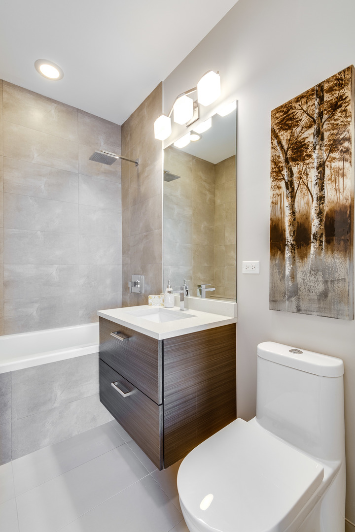 1033 South Racine Avenue, Unit 3SF Chicago, IL 60607 - Photo 13 of 19 a bathroom with a sink a toilet and shower