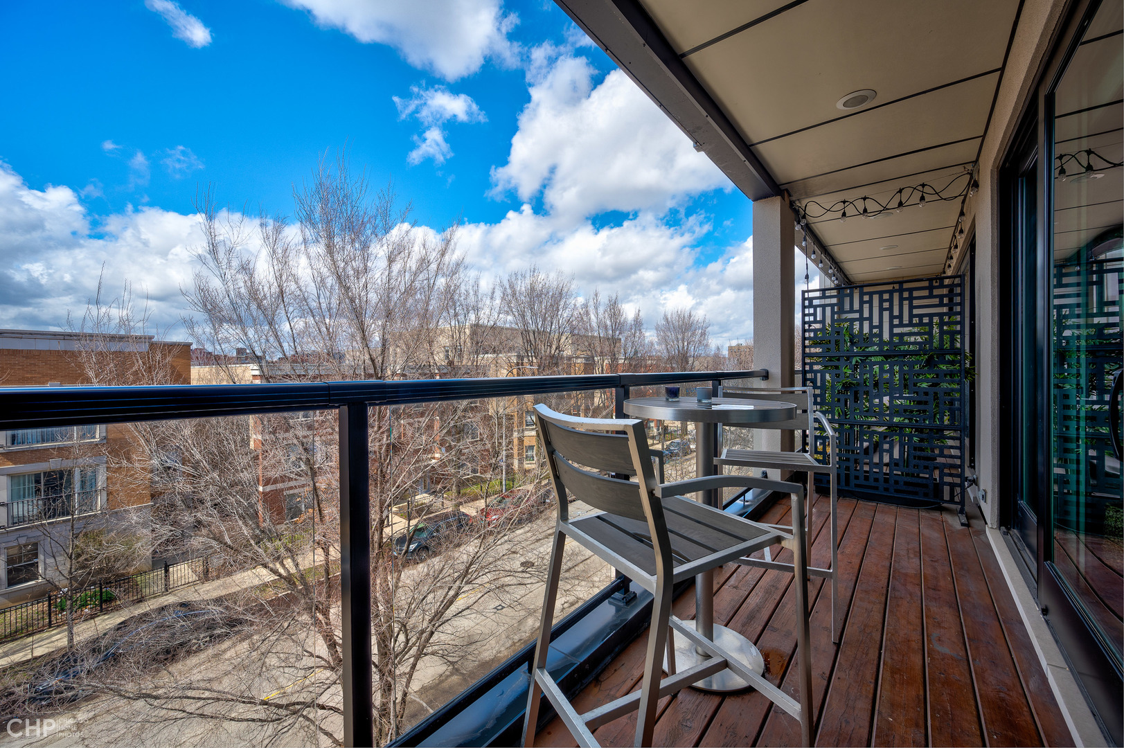 1033 South Racine Avenue, Unit 3SF Chicago, IL 60607 - Photo 16 of 19 a view of a balcony with chairs