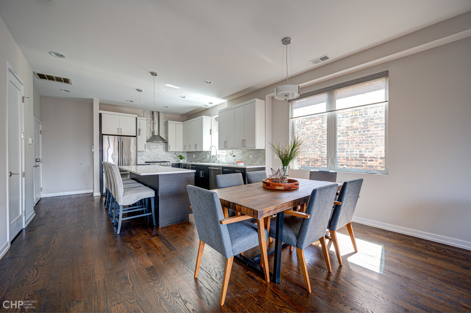 1033 South Racine Avenue, Unit 3SF Chicago, IL 60607 - Photo 5 of 19 a view of a dining room with furniture and wooden floor