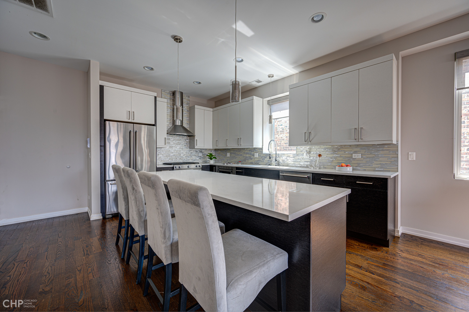 1033 South Racine Avenue, Unit 3SF Chicago, IL 60607 - Photo 6 of 19 a kitchen with kitchen island granite countertop a sink a center island and cabinets