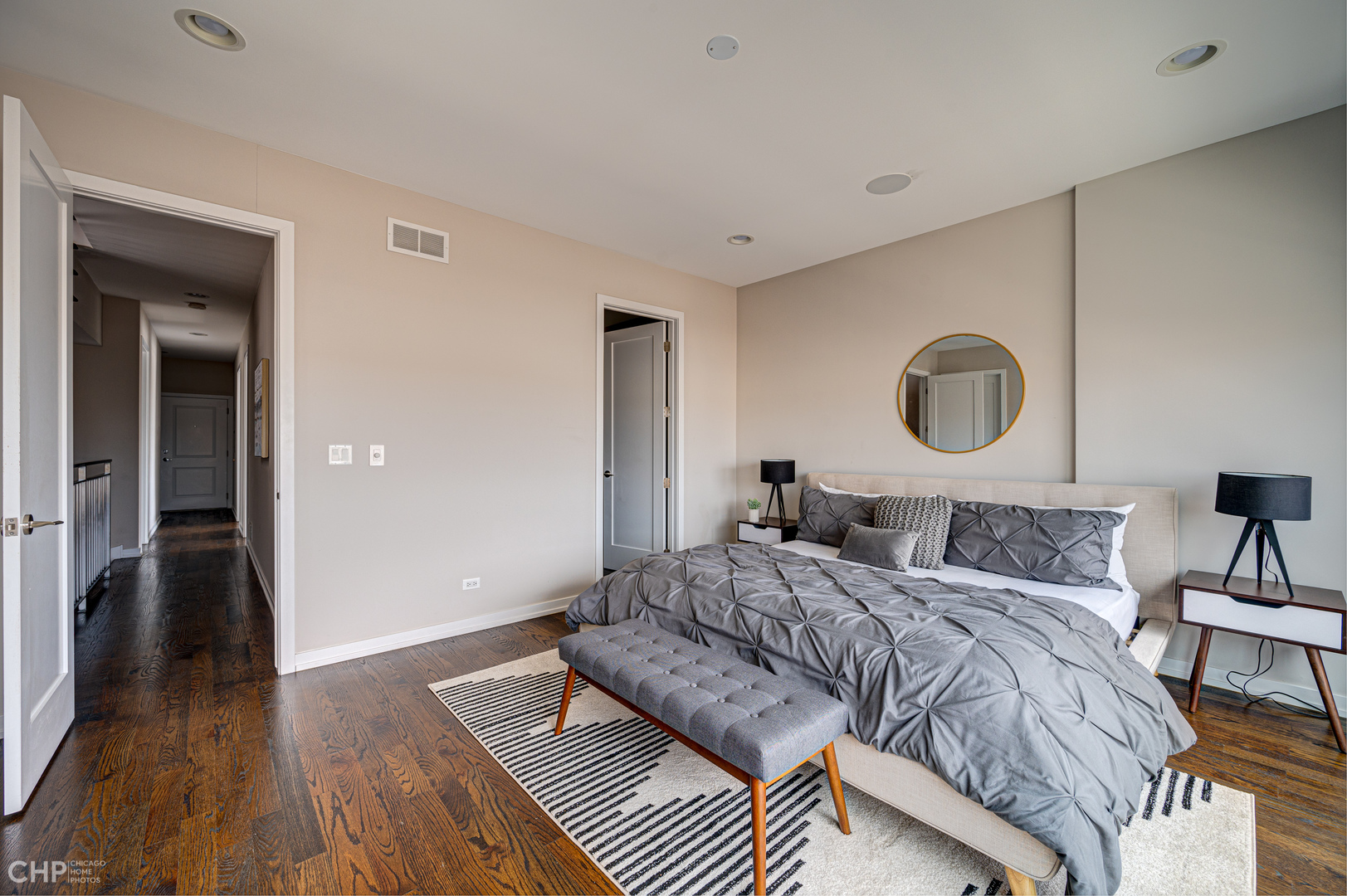 1033 South Racine Avenue, Unit 3SF Chicago, IL 60607 - Photo 9 of 19 a bedroom with a bed and a lamp on table