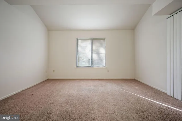 a view of a livingroom with a kitchen