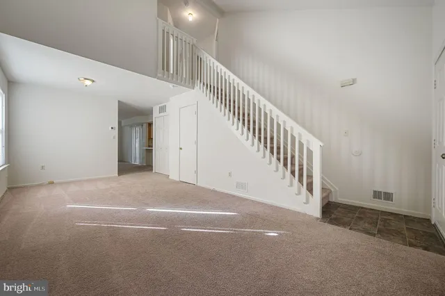 a view of a hallway with stairs