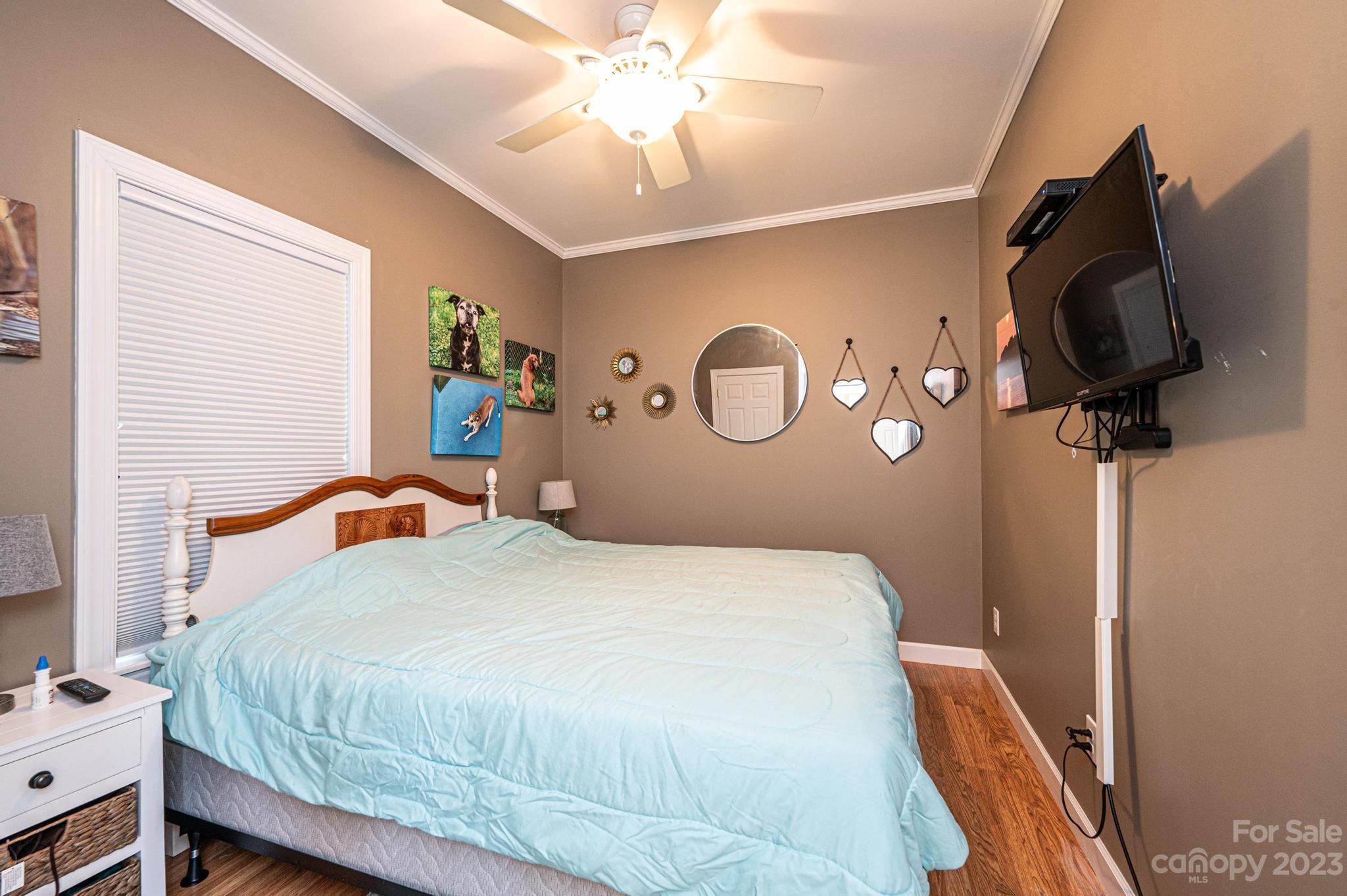209 Catawba Avenue Hickory, NC 28601 - Photo 12 of 28 a bedroom with a bed and cabinets