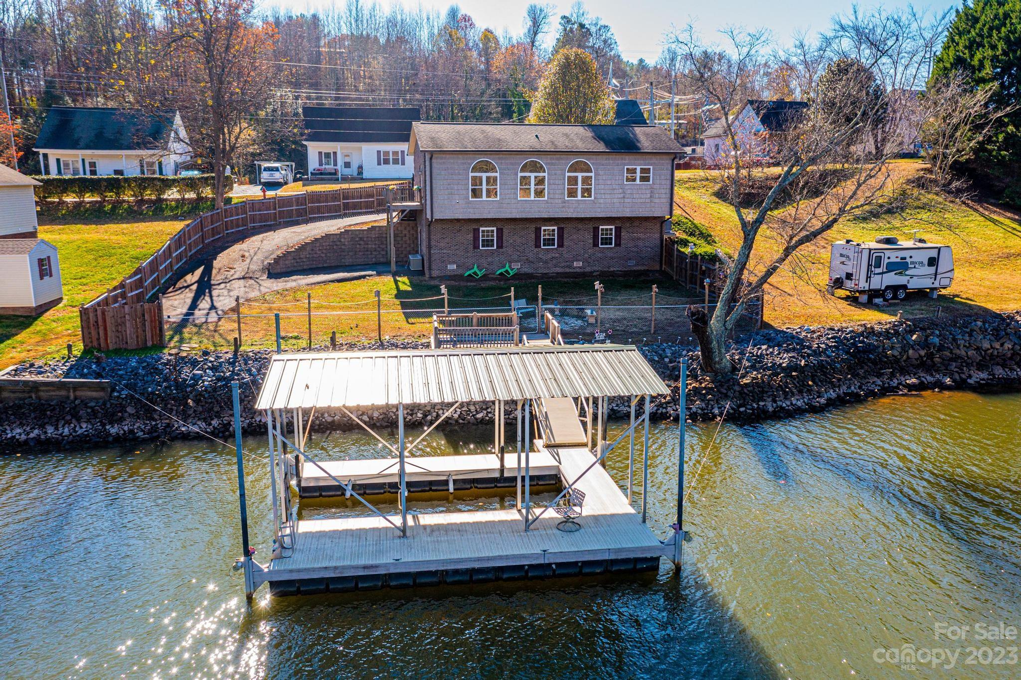 209 Catawba Avenue Hickory, NC 28601 - Photo 2 of 28 a view of a swimming pool with a deck and a patio
