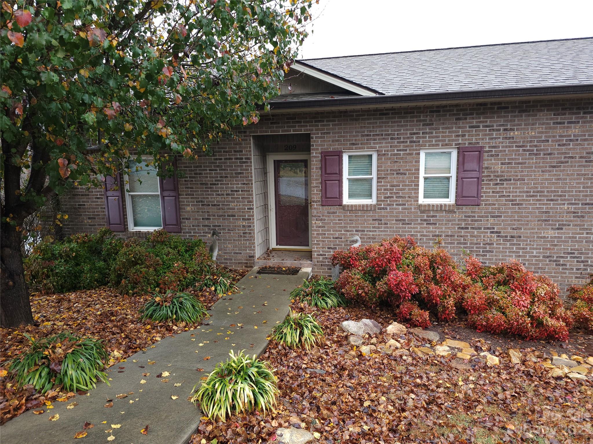 209 Catawba Avenue Hickory, NC 28601 - Photo 3 of 28 a front view of a house with a yard