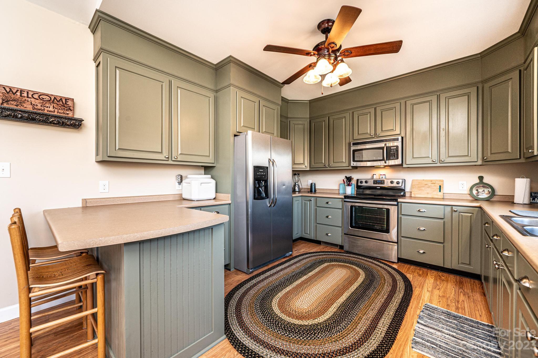 209 Catawba Avenue Hickory, NC 28601 - Photo 7 of 28 a kitchen with a sink appliances and cabinets