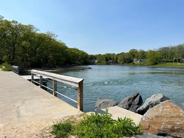 a view of lake with mountain in the background