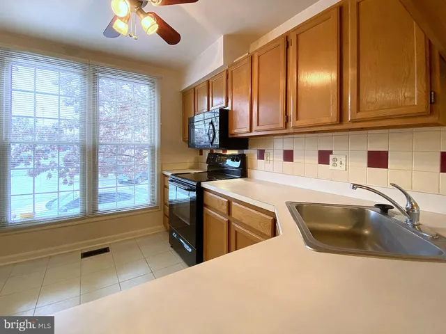 a view of an empty room with a fireplace