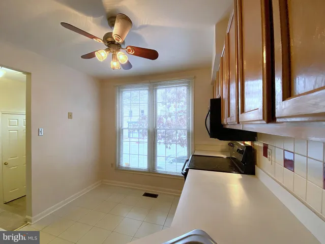 a view of a livingroom with an empty space and a fireplace