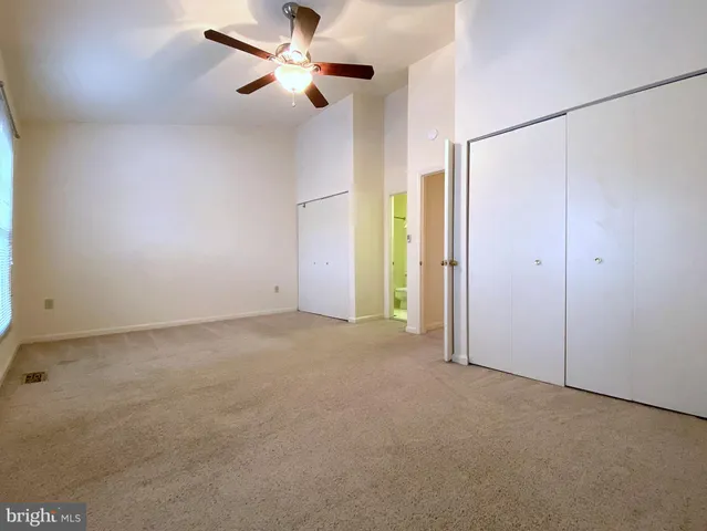 a bathroom with a sink mirror vanity and toilet