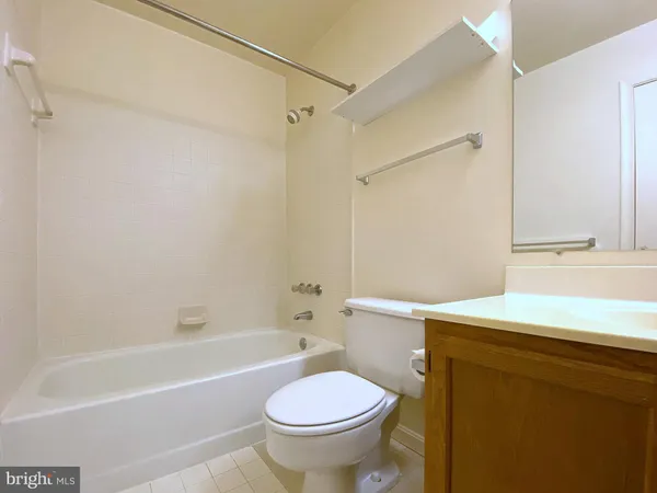 a bathroom with a sink toilet and bathtub