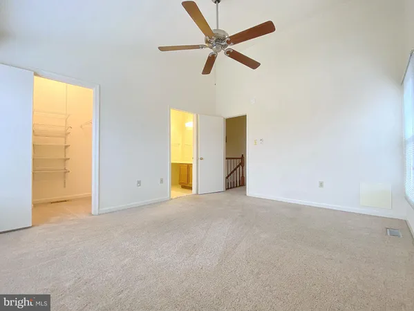 a bathroom with a sink a toilet a mirror and vanity