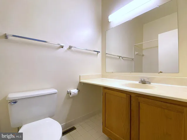 a white bath tub sitting next to a toilet