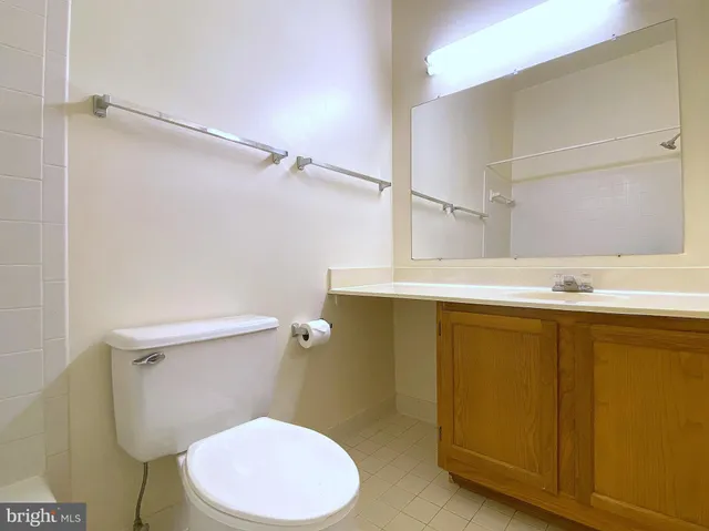 a white bath tub and shower