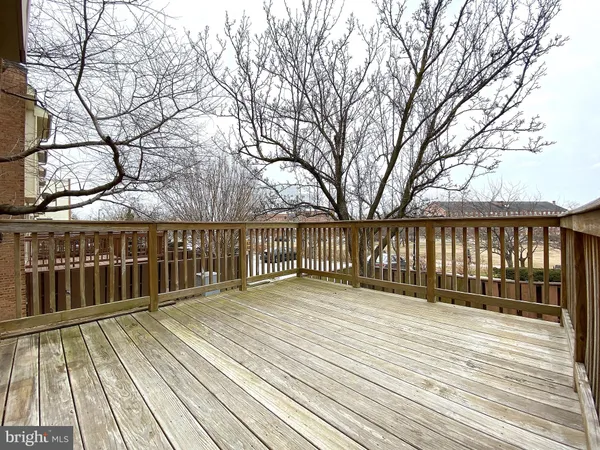 a view of a house with wooden fence