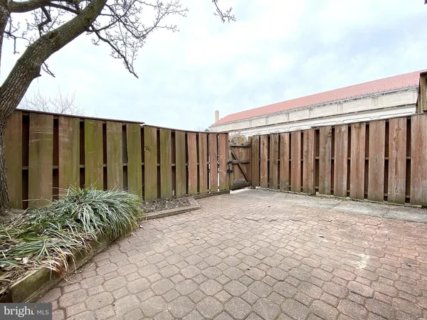 a view of a house with snow on the road