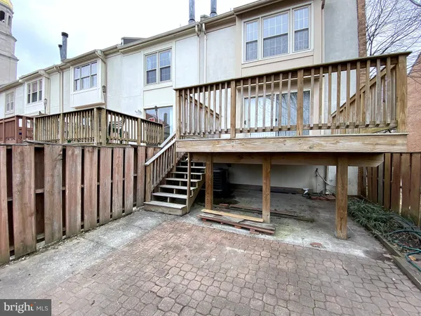 a view of parking with cars parked on road