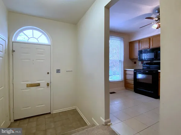 a kitchen with a stove cabinets and a sink