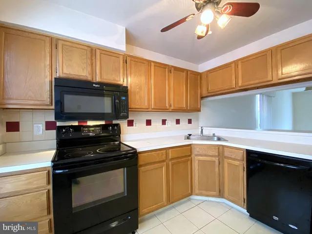 a kitchen that has a sink and a stove