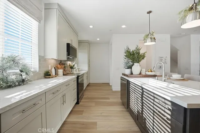 a spacious bathroom with double vanity and a mirror