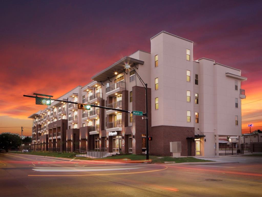 a view of a building with a street