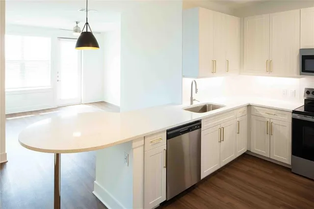 a kitchen with a sink and cabinets