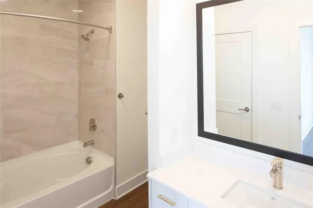 a bathroom with a bathtub and a shower