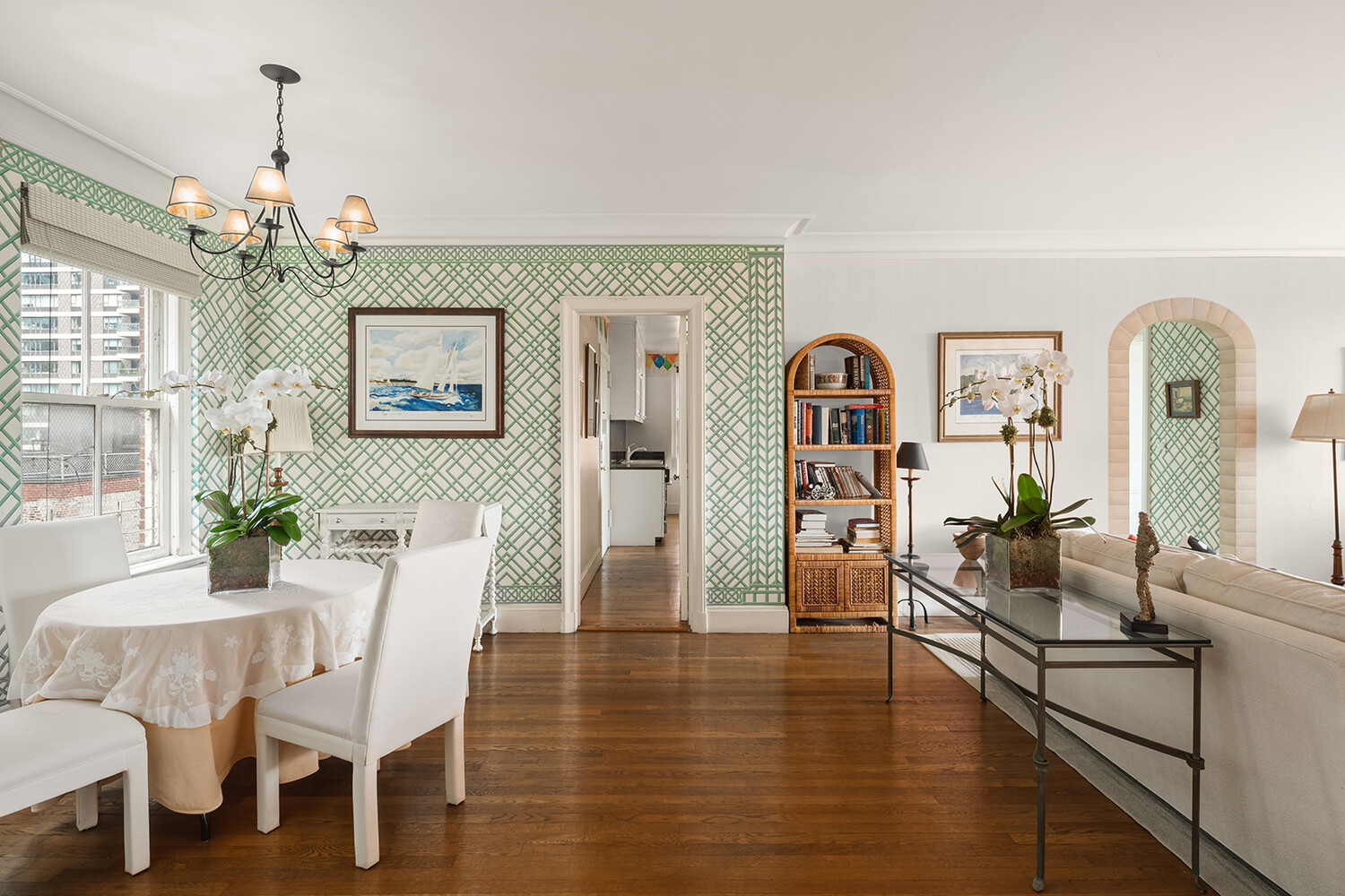 a view of a livingroom with furniture window and wooden floor