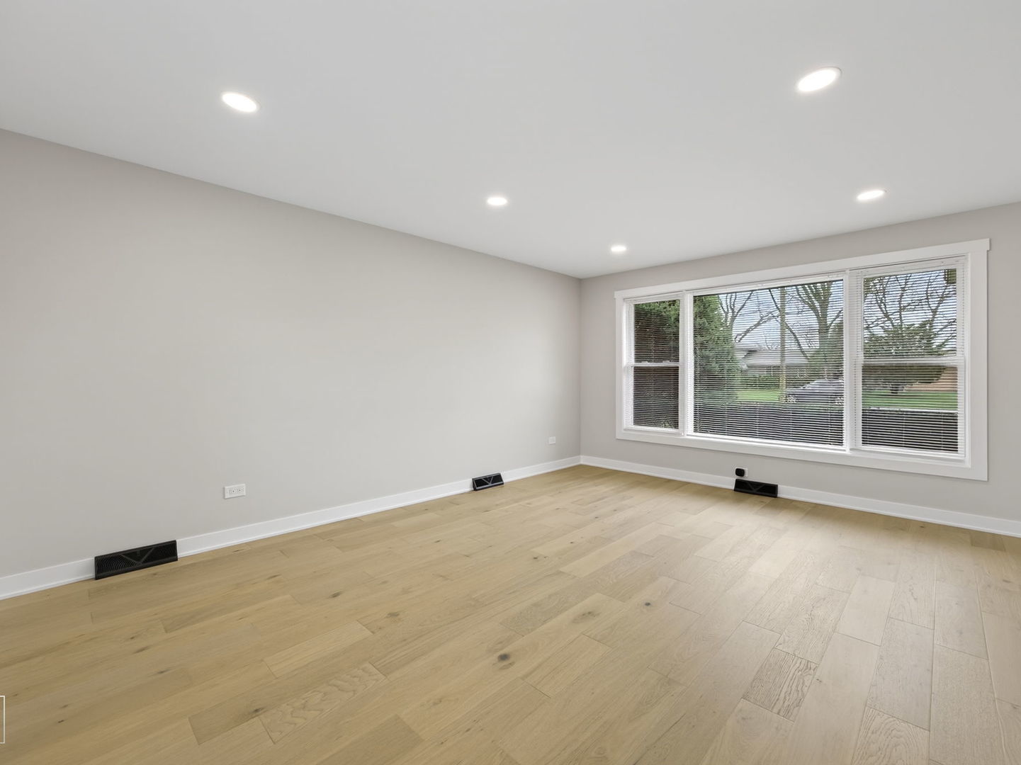 1011 Maitland Drive Lockport, IL 60441 - Photo 3 of 23 an empty room with wooden floor and windows