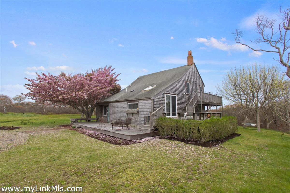 13 Parson Lane Nantucket, MA 02554 - Photo 24 of 44 a front view of a house with garden