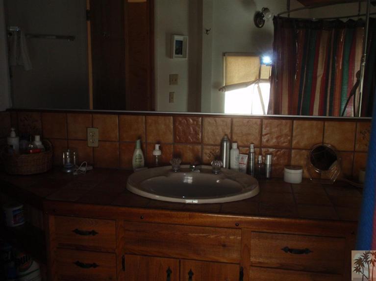 25160 Cougar Road Idyllwild, CA 92549 - Photo 11 of 17 a bathroom with a sink and a mirror